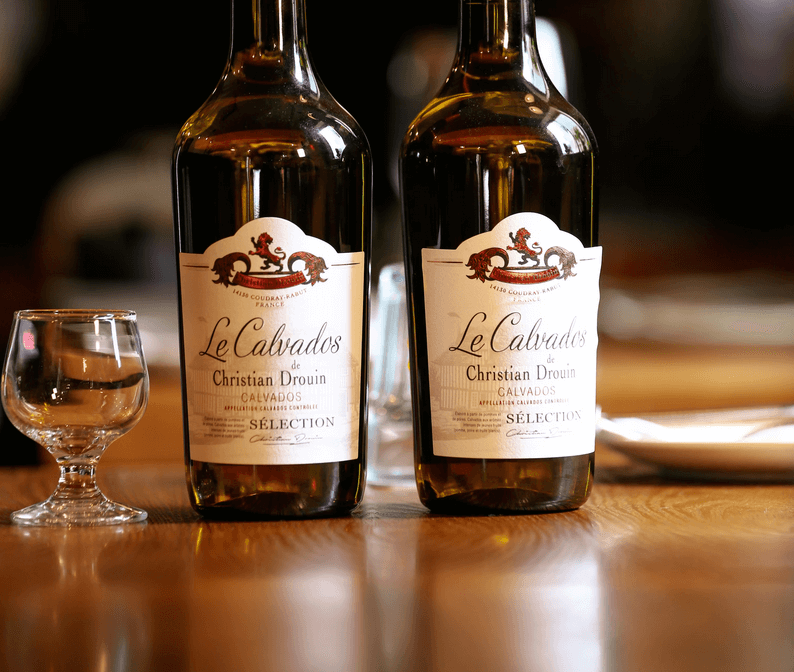 Deux bouteilles de calvados de Christian Drouin.